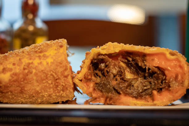 istock Fried pastry with shredded meat and cheddar filling, crispy pastry 1248573139