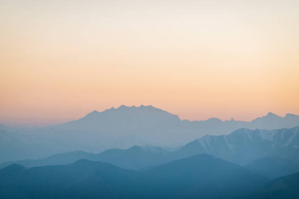 istock Scenic view of sunrise over distant mountain range 1248575744