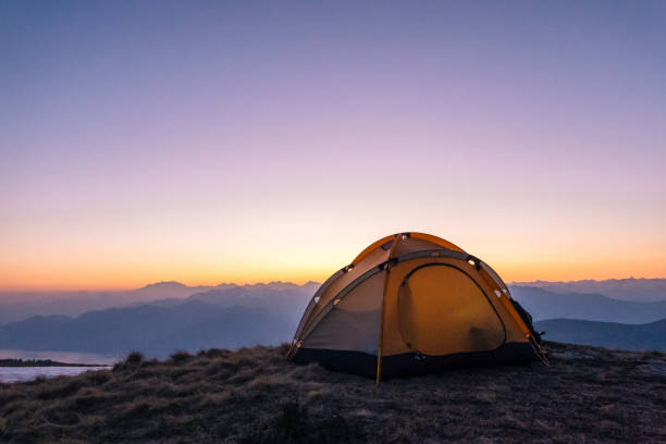 istock Scenic view of camping tent on mountain ridge 1248577290