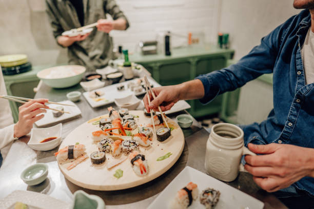 istock Friends having a sushi dinner party 1248583662