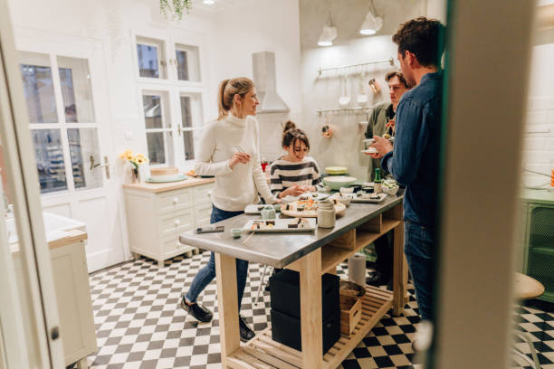 istock Friends eating sushi in the kitchen 1248583663