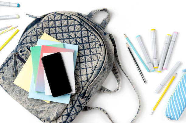 istock Flat lay top view backpack with different colorful stationery 1248584011