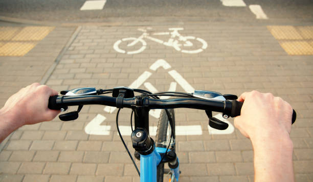 istock A cyclist drove up to the passage through the highway. 1248585399