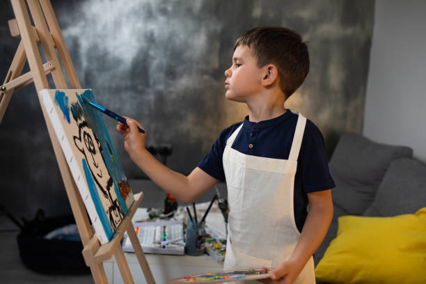 istock A boy enjoying painting 1248585631