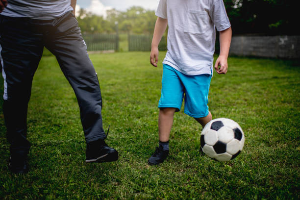istock Playing soccer with grandfather 1248586669