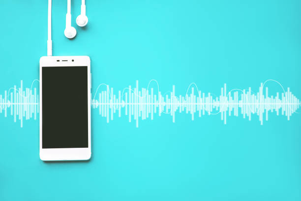 istock Mobile phone with empty screen and earphones on cyan background with Audio track. 1248586855