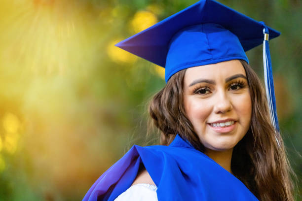 istock Smiling young woman celebrating her graduation 1248588109