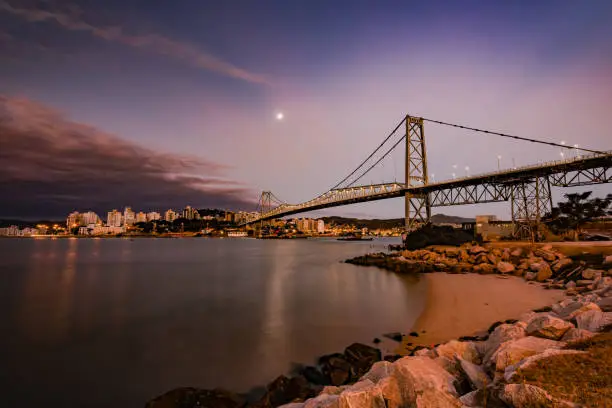 Photo of new bridge Hercilio Luz Florianopolis, Santa Catarina, Brazil, image made from the continent, showing the sunset