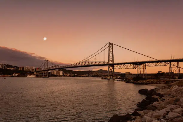 Photo of new bridge Hercilio Luz Florianopolis, Santa Catarina, Brazil, image made from the continent, showing the sunset