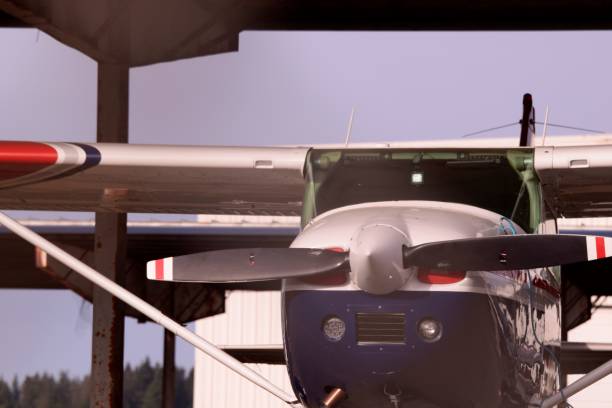 istock Front View Of Propeller Airplane In Hangar 1248594309