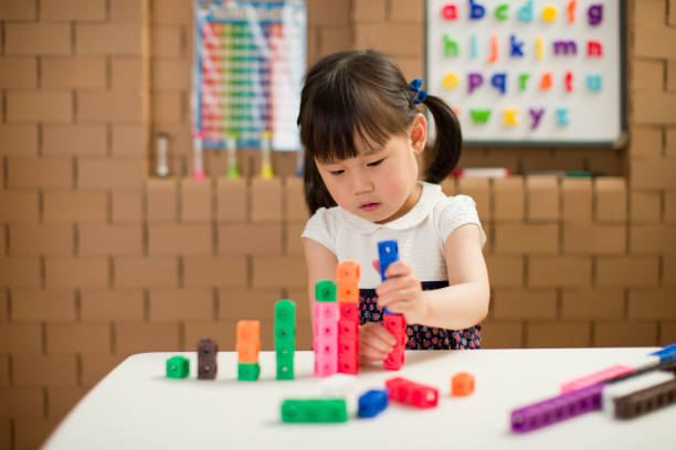 toddler girl play number blocks for homeschooling toddler girl play number blocks for homeschooling counting photos stock pictures, royalty-free photos & images