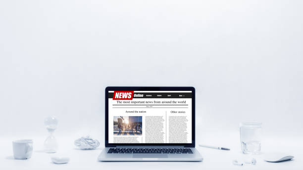 istock news on a computer screen. Mockup website. Newspaper and portal on internet 1248597148