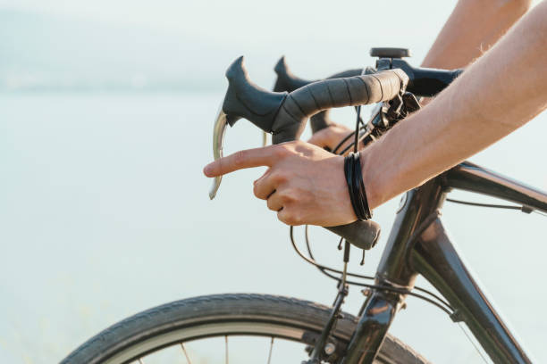 istock Male hands on a steering wheel with brakes. 1248597293