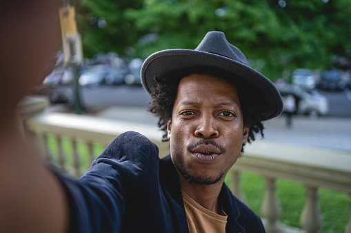 African American man exploring Buenos Aires and taking selfies