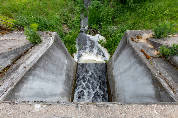 istock Concrete dam seen from above. Small hydropower plant. Spring season. 1248605468