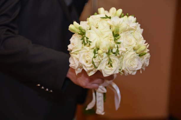istock GROOM  with  wedding bouquet 1248609244
