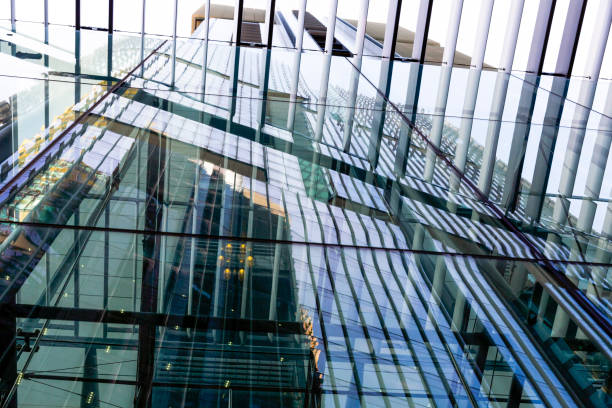 istock Closeup glass office building with reflection, view through pedestrian sunshade, copy space 1248611026