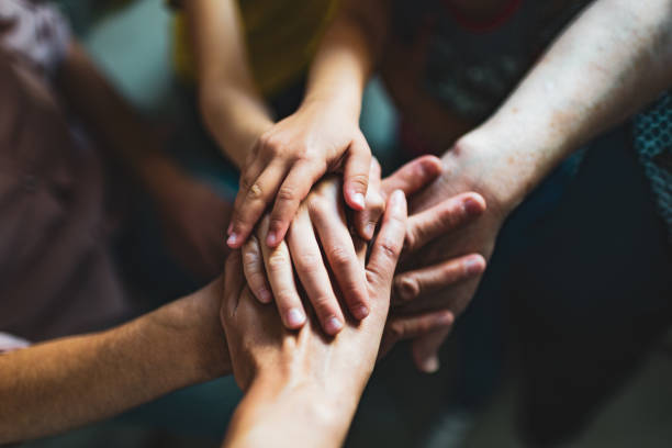 Holding hands Multi-generation family holding hands. family holding hands stock pictures, royalty-free photos & images