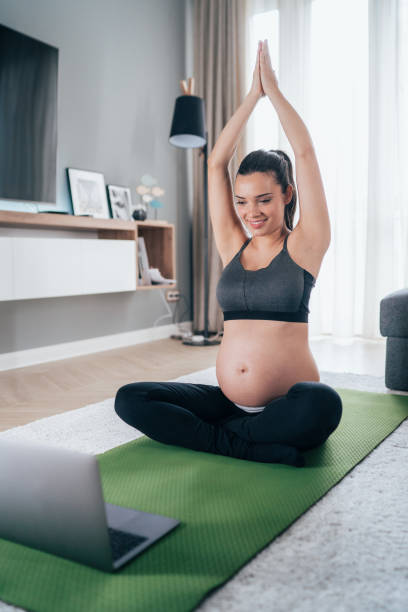 istock Pregnant women doing yoga 1248617791