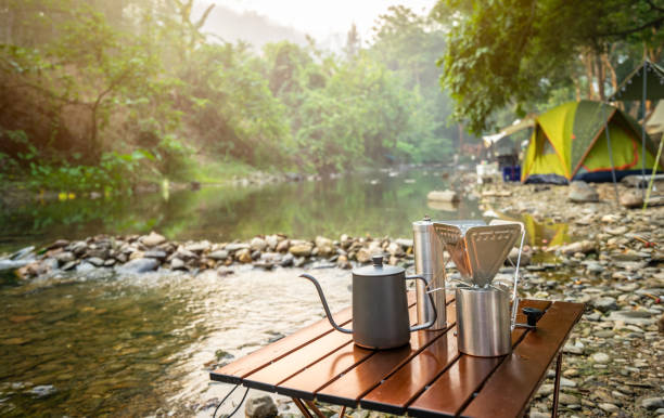 istock coffee drip while camping near the river in nature park 1248617842