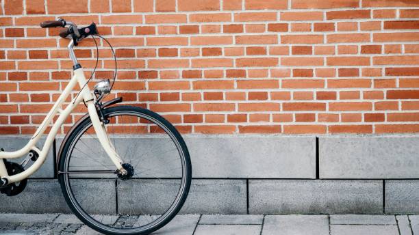 istock Vintage bicycle on the brick wall background, 16:9 panoramic format. 1248619503