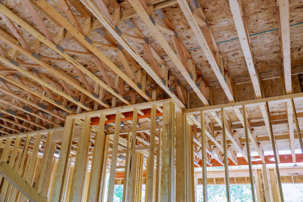 istock Framing home unfinished wood frame building or a house 1248626603
