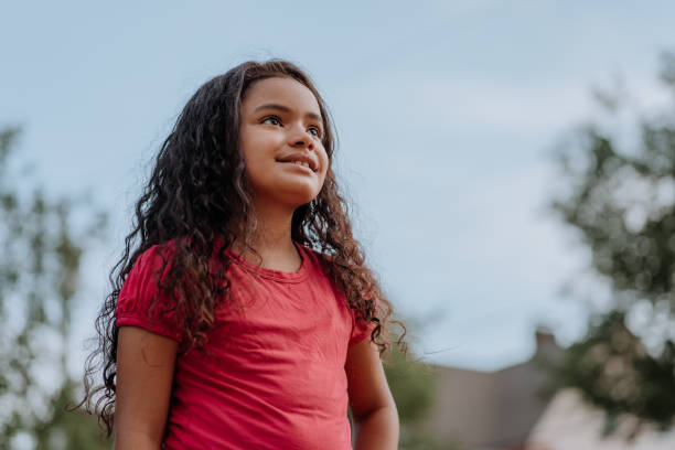 istock Young black girl looking away 1248628343