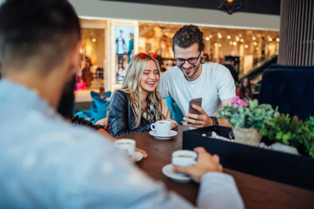 istock Sharing their online photo at the cafe 1248628387