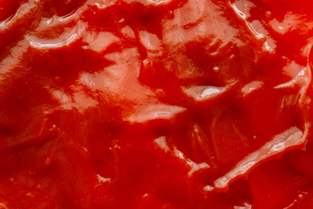 istock Tomato sauce ketchup texture background close up 1248630086