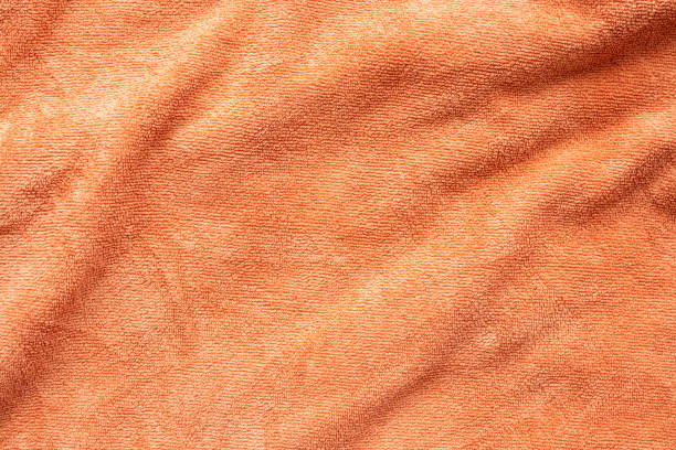 istock Orange towel fabric texture surface close up background 1248630090