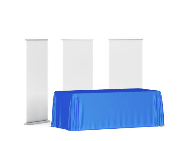 istock Blank tradeshow tablecloth with roll-up banners aside 1248630678