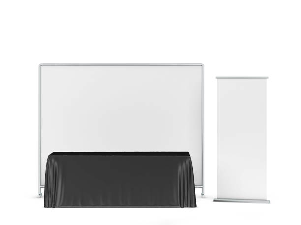 istock Blank tradeshow tablecloth with roll-up banners aside 1248630689