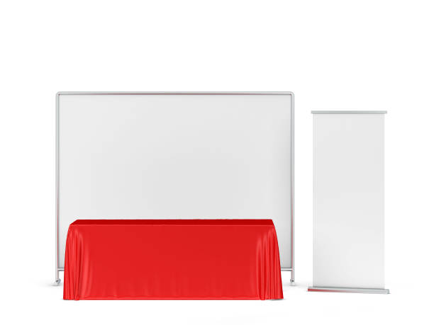 istock Blank tradeshow tablecloth with roll-up banners aside 1248630701