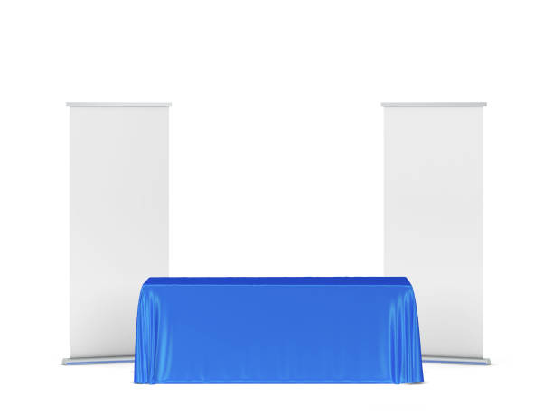 istock Blank tradeshow tablecloth with roll-up banners aside 1248630711