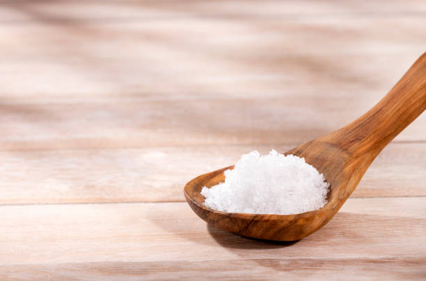 istock Magnesium chloride in wooden spoon - Text space 1248637783