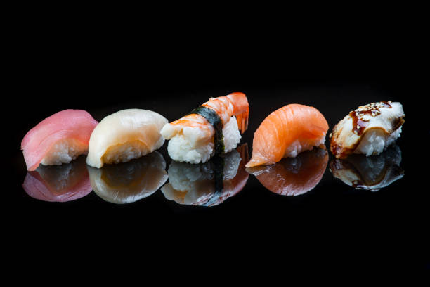 istock Sushi Roll On A Black Background reflection . Japanese food. Close Up. 1248643589