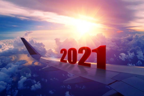 istock Airplane wing flying at sunrise in 2021 1248644582