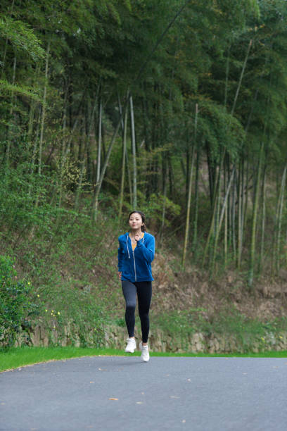 istock A young Asian woman is running 1248646958