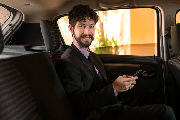 istock Handsome latin business man smiling at camera at car service 1248648025
