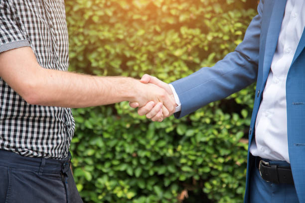 istock Congratulation to collaboration partner after sign on contract. Diverse Businessman shake hands together with businessman to introduce meeting. Trustworthy student friends meeting. Business Concept 1248652284