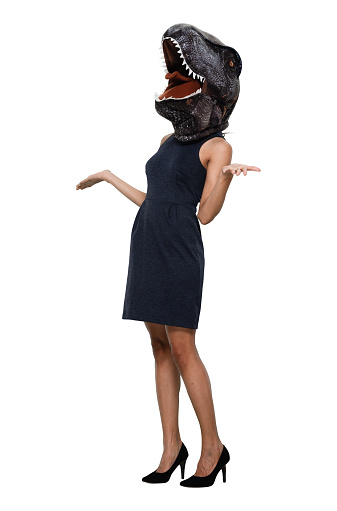 One person of aged 30-39 years old who is beautiful with ponytail african ethnicity female business person standing in front of white background in the office wearing costume and high heels and wearing wearing dinosaur mask mask