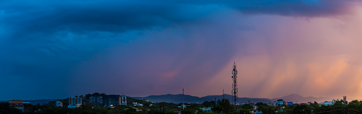 Dramatic panorama view of evening gradient sky as sun was setting down at Pune city, Maharashtra - India
