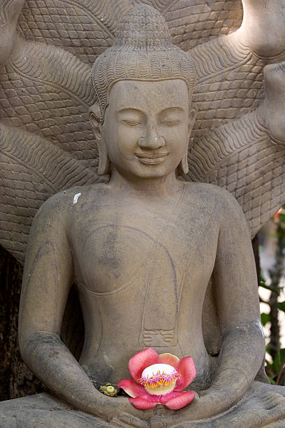 istock Stone statue of Buddha holds a flower, Cambodia 124865368
