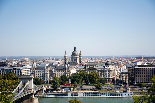 View landscape and cityscape of Budapest old town city and Hungarian Parliament with tour cruises in Danube Delta river and Budapest Chain Bridge in Budapest, Hungary