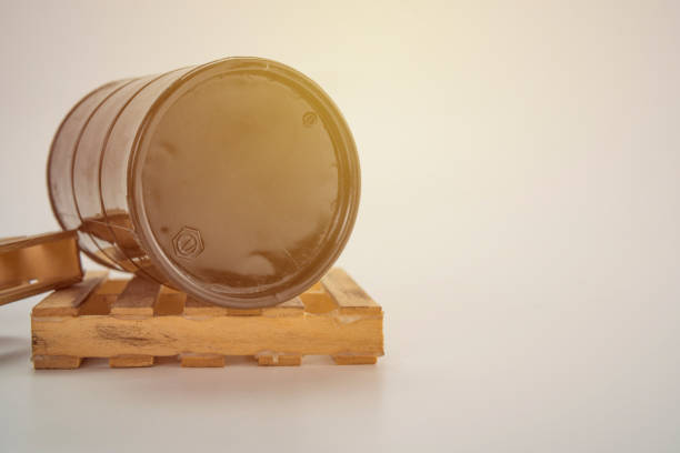 istock Black oil barrel on wood pallet with white background. 1248656558