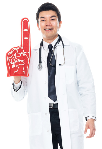 Portrait of aged 30-39 years old with short hair chinese ethnicity male fan - enthusiast standing in front of white background wearing businesswear who is happy and cheering who is showing with hand and holding foam hand