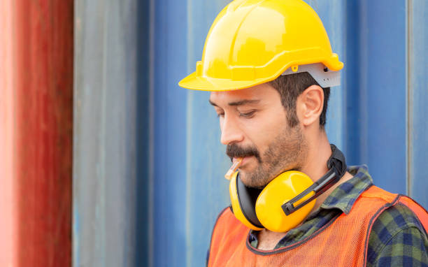 istock Worker with a cigarette smoke break, Labour takes a cigarette break 1248658723