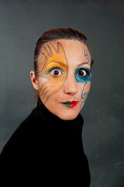 istock Young girl making a funny face with strange makeup 124866051
