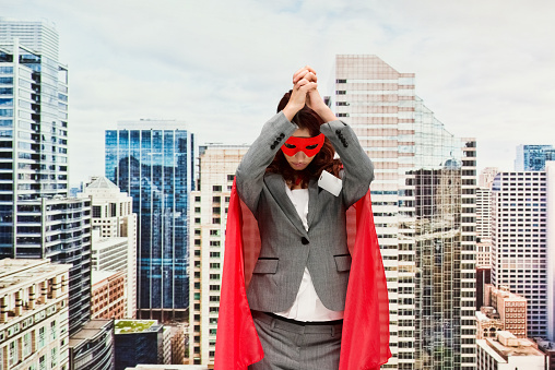 Superhero standing wearing cape - garment who is christianity who is praying