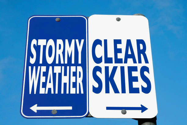 istock Stormy Weather / Clear Skies sign. 1248662225